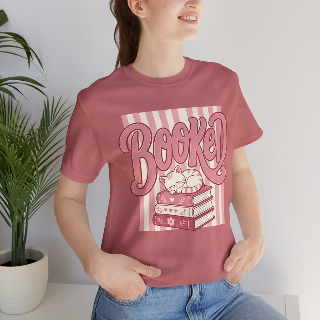 Booked Tee — Cute Cat on Stack of Books Graphic Shirt