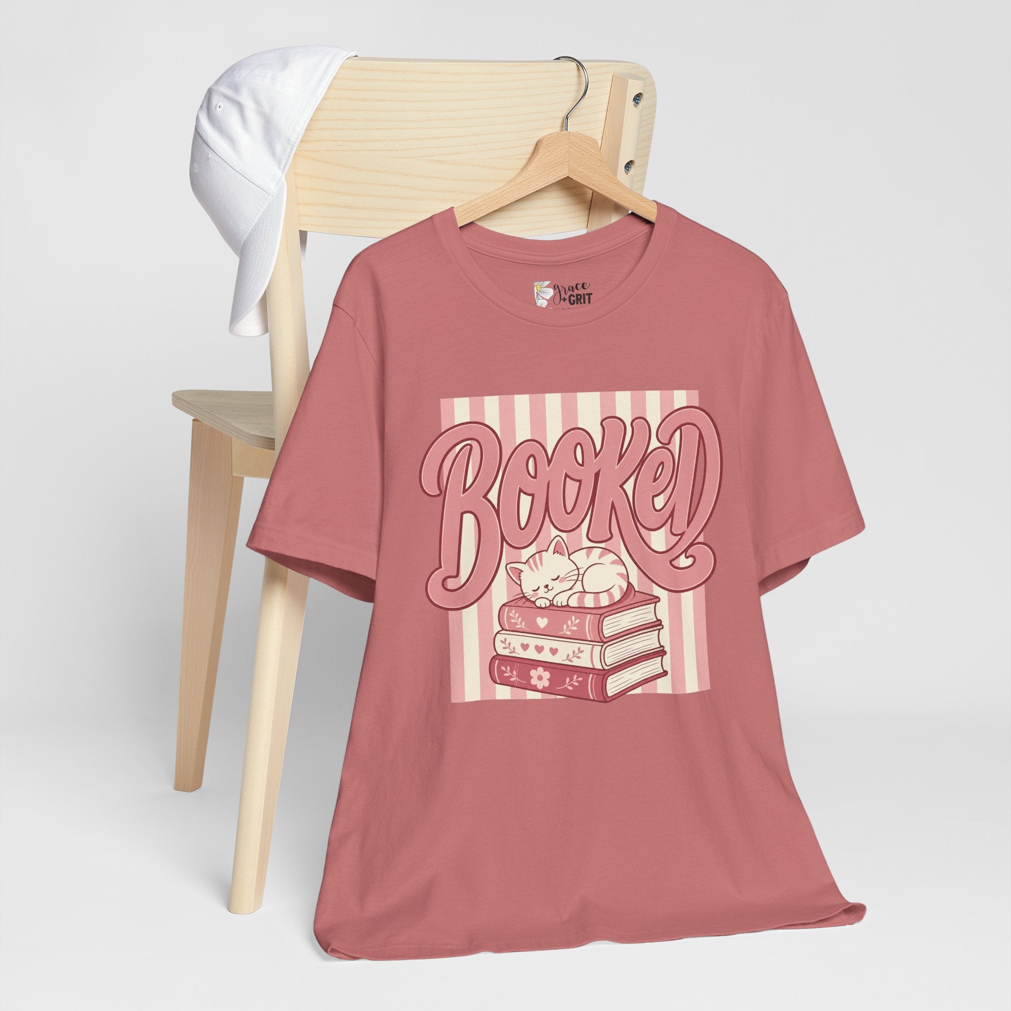 Booked Tee — Cute Cat on Stack of Books Graphic Shirt