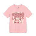 Booked Tee — Cute Cat on Stack of Books Graphic Shirt