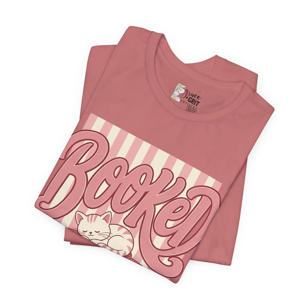 Booked Tee — Cute Cat on Stack of Books Graphic Shirt